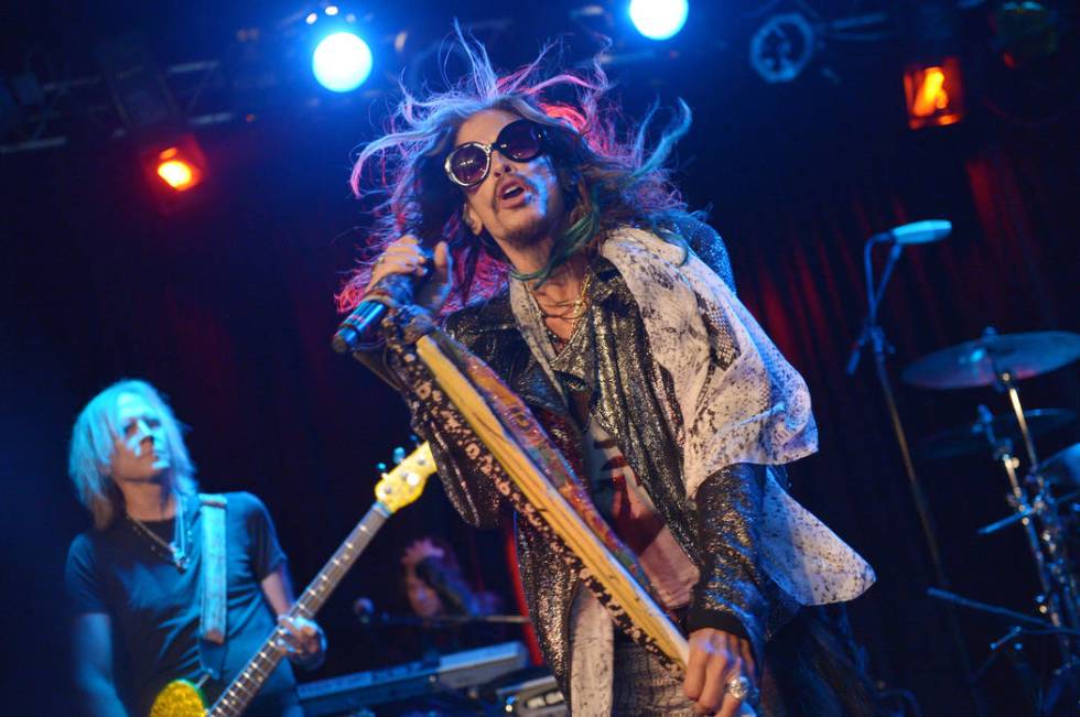 Tom Hamilton, left, and Steven Tyler of Aerosmith perform at the Whisky A Go Go on Tuesday, April 8, 2014, in Los Angeles. Aerosmith announced their “Let Rock Rule” summer tour featuring Slash ...