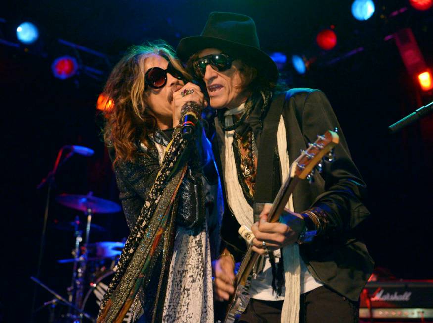 FILE - In this April 8, 2014 file photo, Steven Tyler, left, and Joe Perry of Aerosmith perform at the Whisky A Go Go in Los Angeles. Though others are canceling events and concerts after the ter ...