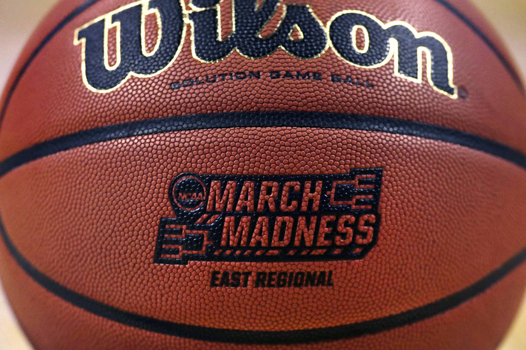 The "March Madness" logo adorns a ball resting on the court during practice at the NCAA men's college basketball tournament in Boston, March 22, 2018. (Charles Krupa/AP)