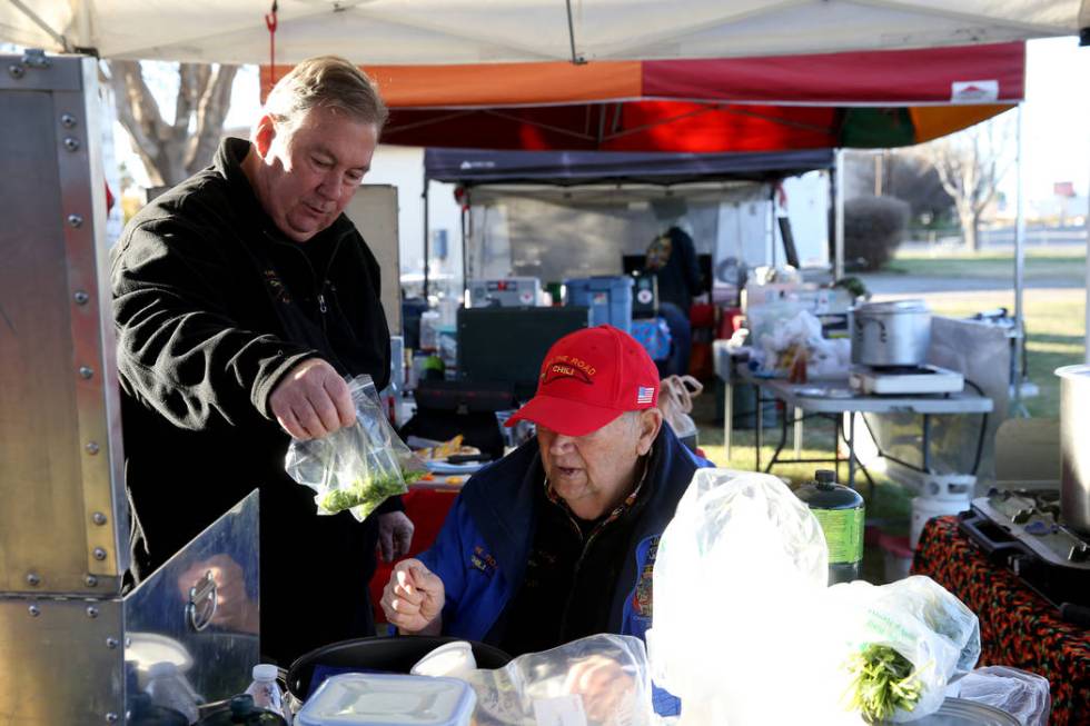 Ken Hook and Chuck Harber, of Corona, California, collaborate with ingredients for their competition chili at the Nevada State Chili Cook-off at Petrack Park in Pahrump Sunday, March 17, 2019. (K. ...