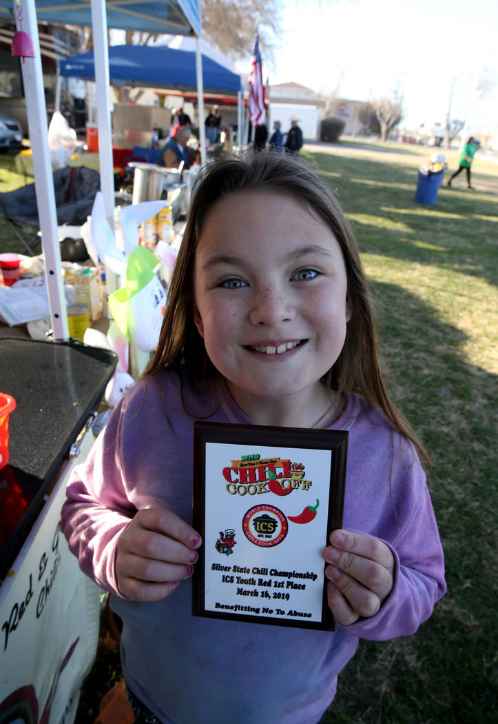 Ily Anthony, 10, of Laughlin shows her award for winning the Silver State Chili Championship Youth Red category the previous day while supporting her parents competing in the Nevada State Chili Co ...