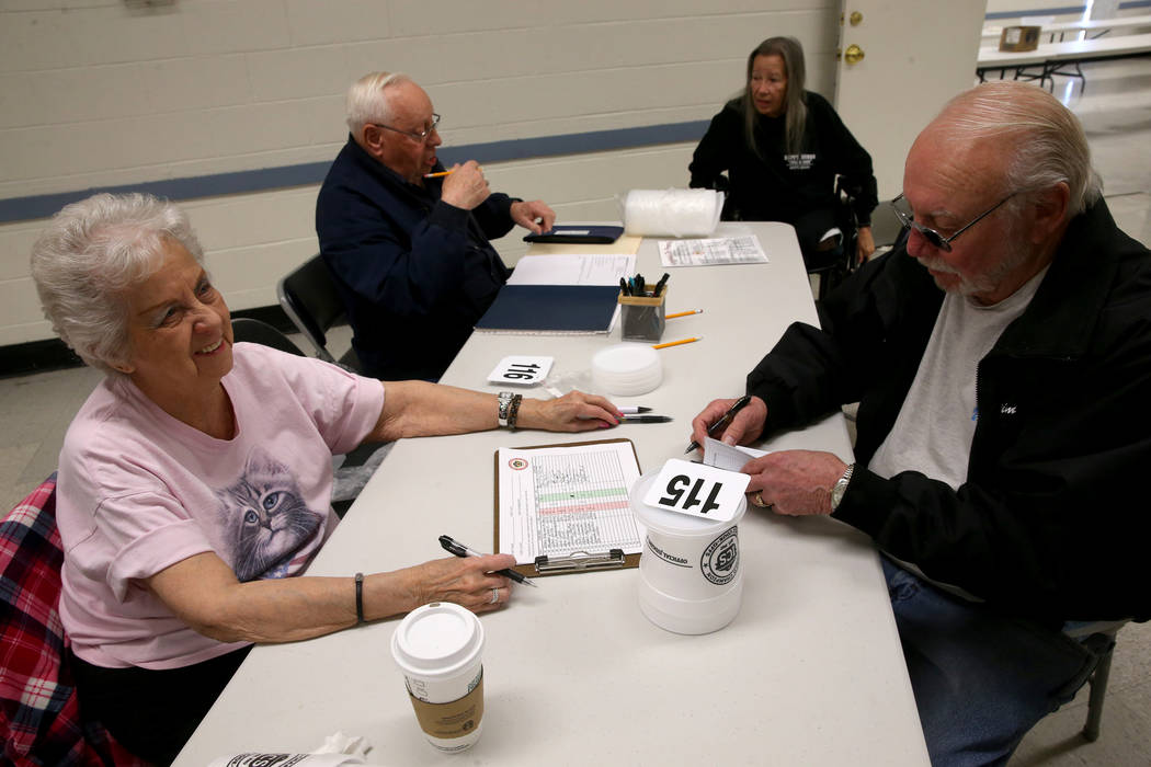 Bobbie Gaul of Pahrump, left, signs in Jim Watson of Nampa, Idaho to compete in the Nevada State Chili Cook-off at Petrack Park in Pahrump Sunday, March 17, 2019. (K.M. Cannon/Las Vegas Review-Jou ...