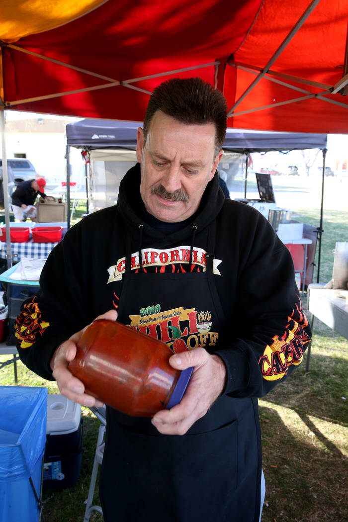 Tony Austin of San Bernardino, California, shakes his chili ingredients in his booth at the Nevada State Chili Cook-off at Petrack Park in Pahrump Sunday, March 17, 2019. (K.M. Cannon/Las Vegas Re ...