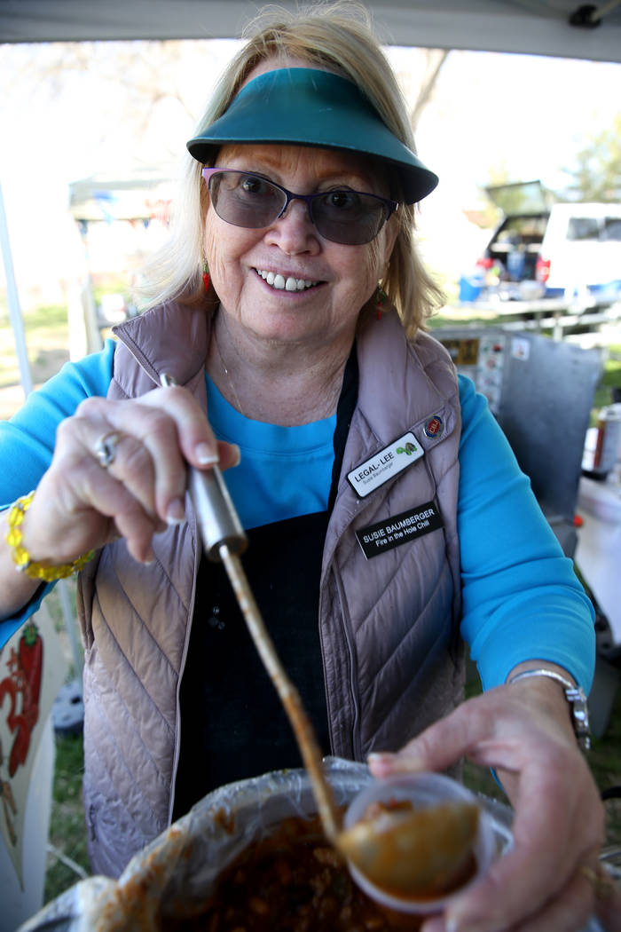 Susie Baumberger of Lancaster, California, offers a sample of her People's Choice chili at her booth during the Nevada State Chili Cook-off at Petrack Park in Pahrump Sunday, March 17, 2019. (K.M. ...