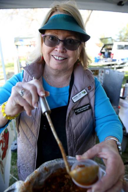 Susie Baumberger of Lancaster, California, offers a sample of her People's Choice chili at her booth during the Nevada State Chili Cook-off at Petrack Park in Pahrump Sunday, March 17, 2019. (K.M. ...