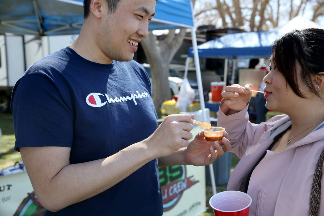 Jiefei Wang and his fiancee Jin Zhou of Buffalo, New York, sample People's Choice chili during the Nevada State Chili Cook-off at Petrack Park in Pahrump Sunday, March 17, 2019. (K.M. Cannon/Las V ...