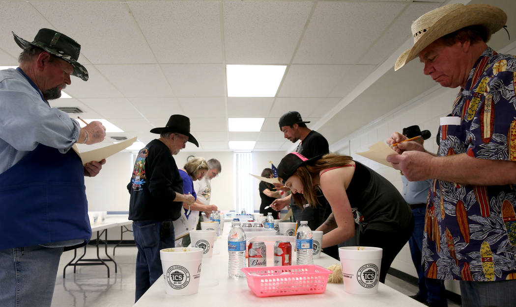 Judges, including Larry Snow, left, and Dan Wright, right, both of Pahrump, during the Homestyle category competition chili at the Nevada State Chili Cook-off at Petrack Park in Pahrump Sunday, Ma ...