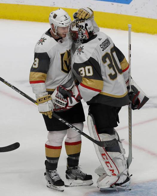 Vegas Golden Knights defenseman Brayden McNabb, left, celebrates with goaltender Malcolm Subban (30) after the Golden Knights defeated the San Jose Sharks in an NHL hockey game in San Jose, Calif. ...