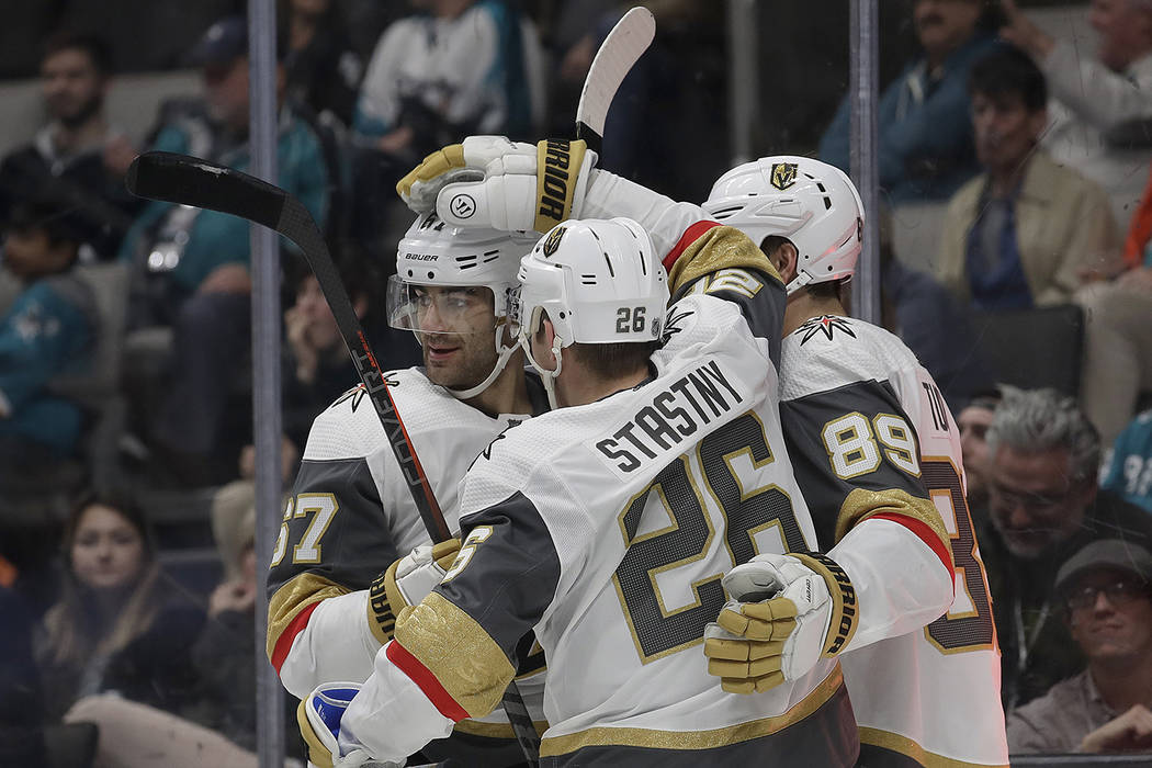Vegas Golden Knights center Paul Stastny (26) is congratulated by teammates after scoring a goal against the San Jose Sharks during the second period of an NHL hockey game in San Jose, Calif., Mon ...
