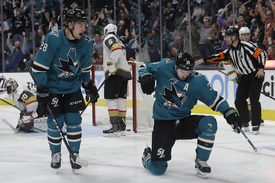 San Jose Sharks center Logan Couture, right, celebrates with right wing Timo Meier (28) after scoring a goal against the Vegas Golden Knights during the first period of an NHL hockey game in San J ...