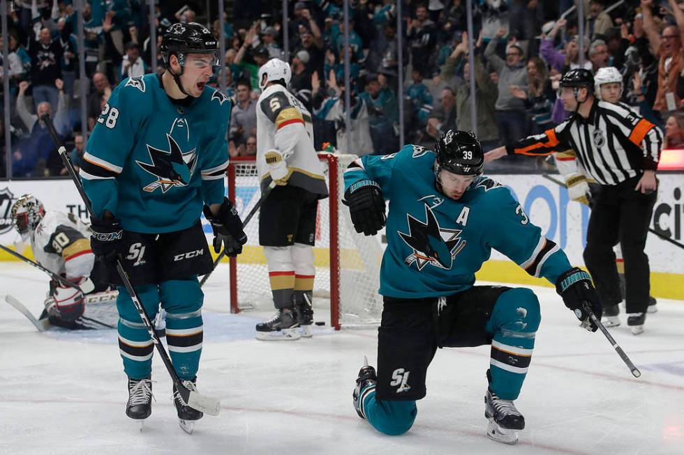 San Jose Sharks center Logan Couture, right, celebrates with right wing Timo Meier (28) after scoring a goal against the Vegas Golden Knights during the first period of an NHL hockey game in San J ...