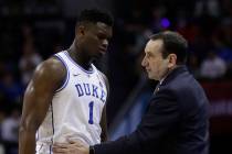 Duke head coach Mike Krzyzewski talks to Zion Williamson (1) during the first half of the NCAA college basketball championship game of the Atlantic Coast Conference tournament in Charlotte, N.C., ...
