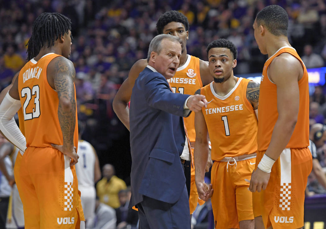 Tennessee head coach Rick Barnes talks with his players, from left, Jordan Bowden (23), Kyle Alexander (11), Lamonte Turner (1) and Grant Williams (2) during a timeout in the second half of an NCA ...