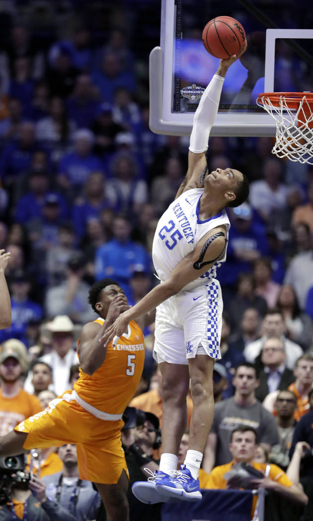 Kentucky forward PJ Washington (25) blocks a shot by Tennessee guard Admiral Schofield (5) but was called for goaltending in the second half of an NCAA college basketball game at the Southeastern ...