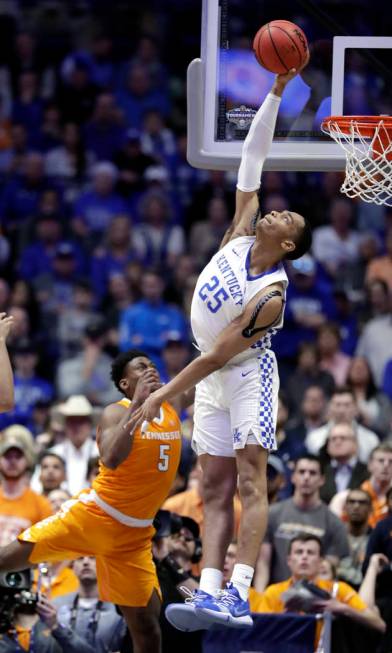 Kentucky forward PJ Washington (25) blocks a shot by Tennessee guard Admiral Schofield (5) but was called for goaltending in the second half of an NCAA college basketball game at the Southeastern ...