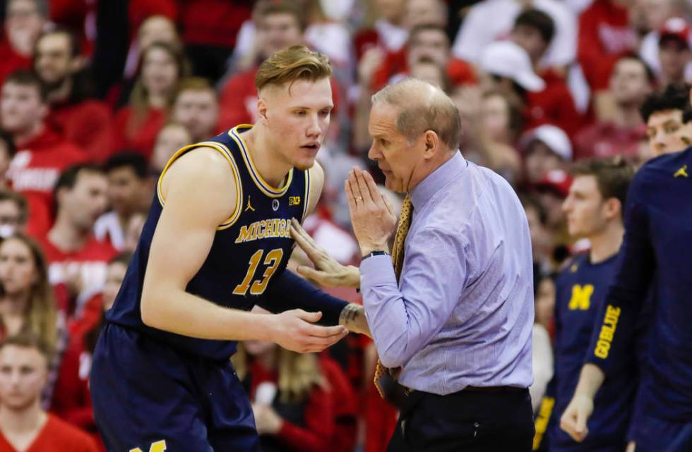 Michigan head coach John Beilein and Ignas Brazdeikis during the second half of an NCAA college basketball game Saturday, Jan. 19, 2019, in Madison, Wis. Wisconsin upset Michigan 64-54. (AP Photo/ ...