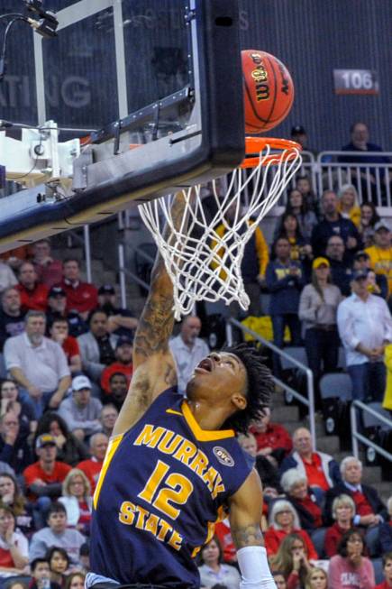 Murray State's Ja Morant (12) goes up for a slam dunk during the first half of an NCAA college basketball game in the championship of the Ohio Valley Conference basketball tournament, Saturday, Ma ...