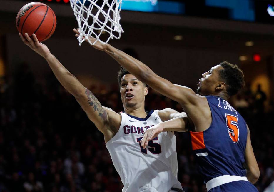 Gonzaga's Brandon Clarke shoots around Pepperdine's Jade' Smith during the first half of an NCAA semifinal college basketball game at the West Coast Conference tournament, Monday, March 11, 2019, ...