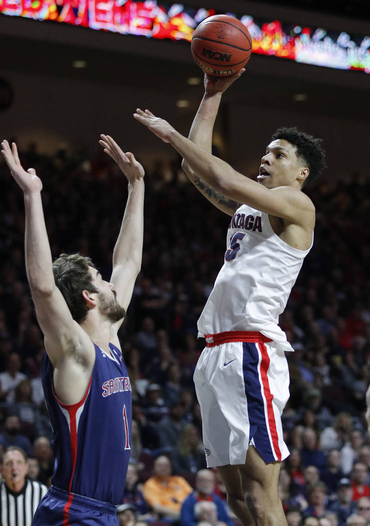 Gonzaga's Brandon Clarke shoots over St. Mary's Jordan Hunter during the first half of an NCAA college basketball game for the West Coast Conference men's tournament title, Tuesday, March 12, 2019 ...