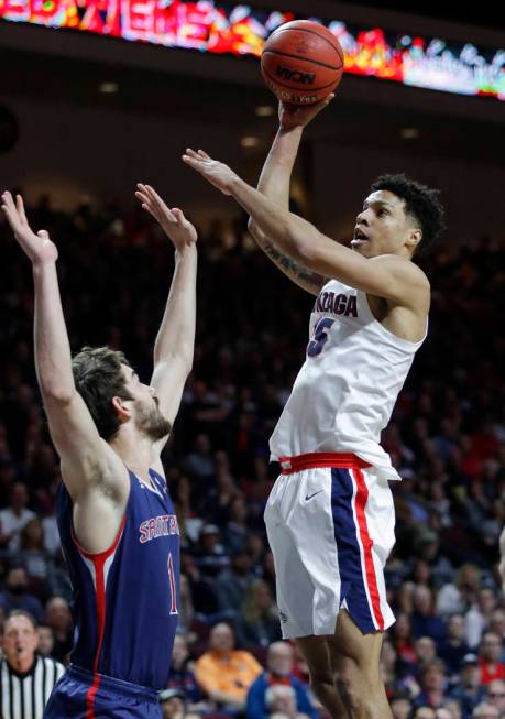 Gonzaga's Brandon Clarke shoots over St. Mary's Jordan Hunter during the first half of an NCAA college basketball game for the West Coast Conference men's tournament title, Tuesday, March 12, 2019 ...