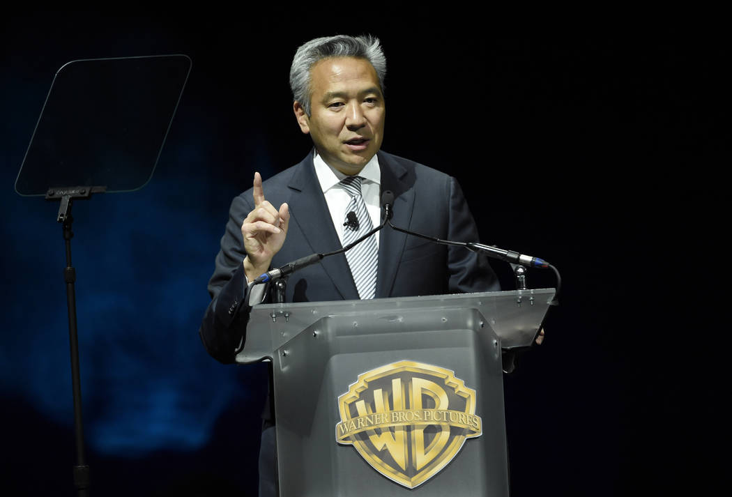 Kevin Tsujihara, chairman and CEO of Warner Bros., during the Warner Bros. presentation at CinemaCon 2015 in Las Vegas, April 21, 2015. Tsujihara is stepping down after claims that he promised act ...