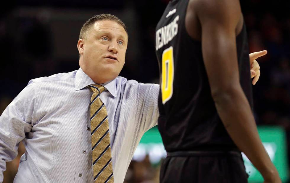 Virginia Commonwealth head coach Mike Rhoades, left, talks with guard De'Riante Jenkins (0) during an NCAA college basketball game against Virginia, Sunday, Dec. 9, 2018, in Charlottesville, Va. ( ...