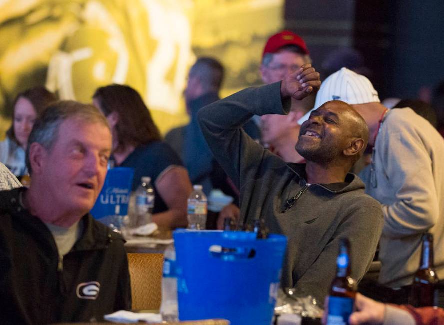 Basketball fans take in the first day of the NCAA Tournament at the Westgate Sportsbook on Thursday, March 21, 2019, at Westgate, in Las Vegas. (Benjamin Hager Review-Journal) @BenjaminHphoto