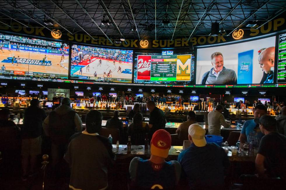 Basketball fans take in the first day of the NCAA Tournament at the Westgate Sportsbook on Thursday, March 21, 2019, at Westgate, in Las Vegas. (Benjamin Hager Review-Journal) @BenjaminHphoto