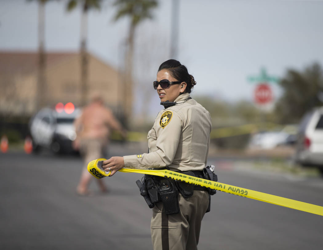 Metro works the scene of an officer-involved shooting in the 500 block of N. 9th Street on Tuesday, March 19, 2019, in Las Vegas. (Benjamin Hager Review-Journal) @BenjaminHphoto