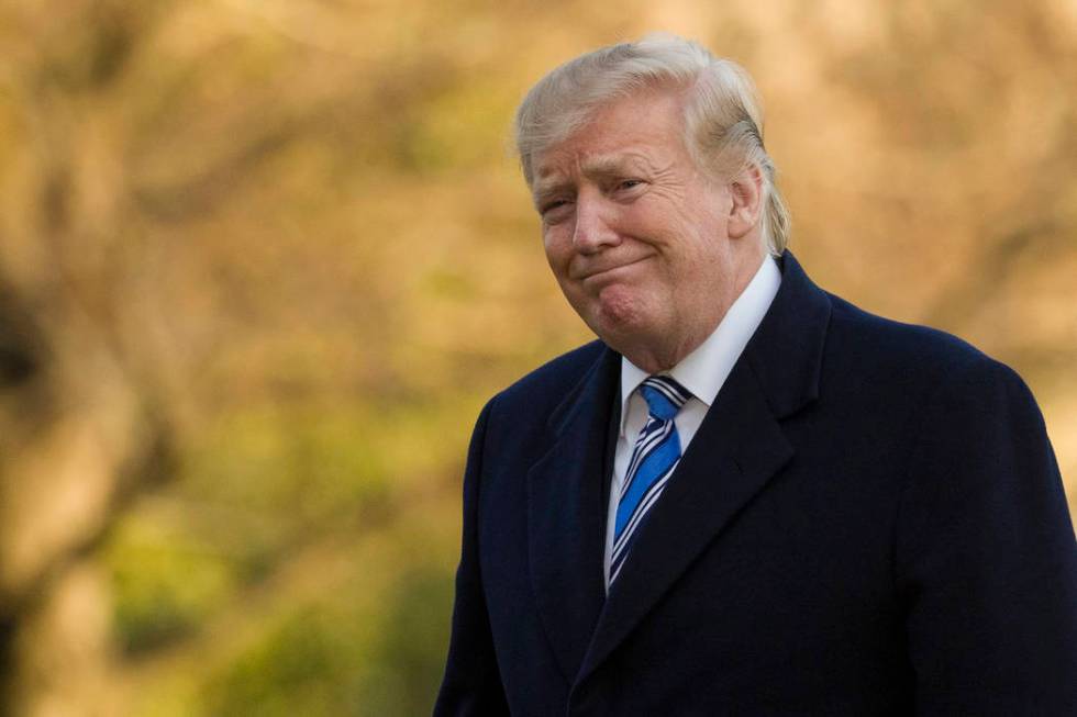 President Donald Trump smiles as he walks on the South Lawn after stepping off Marine One at the White House, Sunday, March 10, 2019, in Washington. (Alex Brandon/AP)