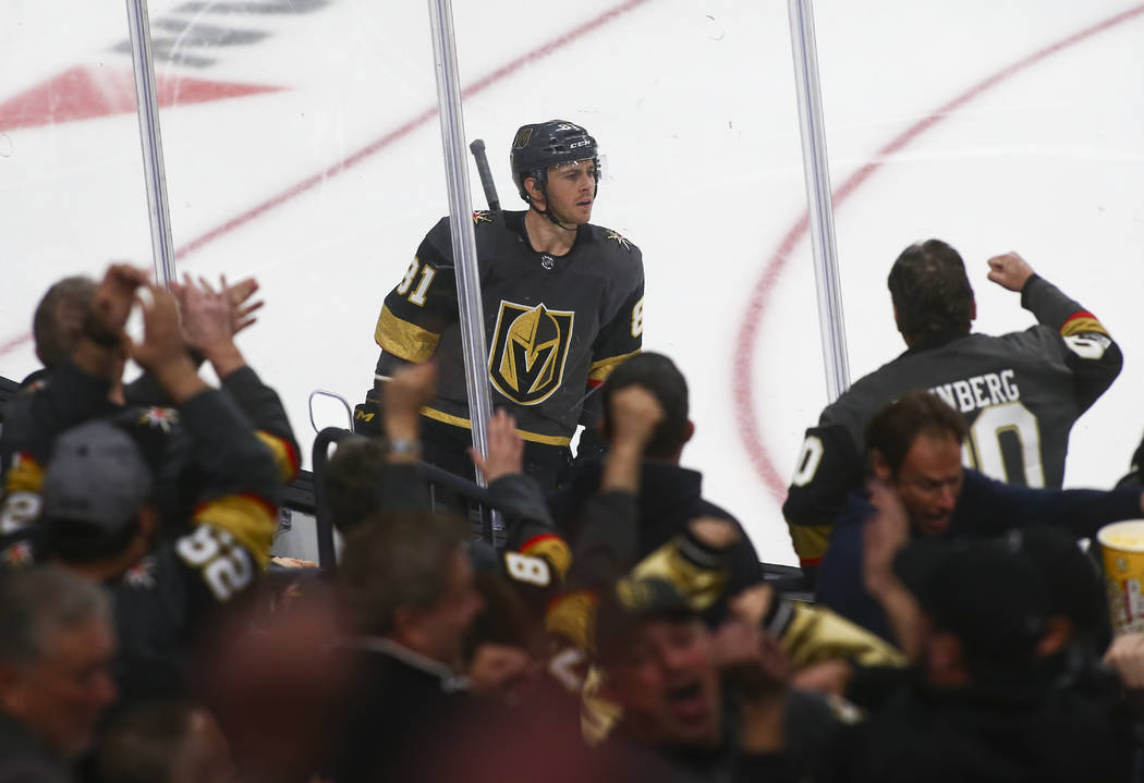 Fans celebrate a goal by Golden Knights center Jonathan Marchessault (81) during the third period of an NHL hockey game against the Winnipeg Jets at T-Mobile Arena in Las Vegas on Friday, Feb. 22, ...