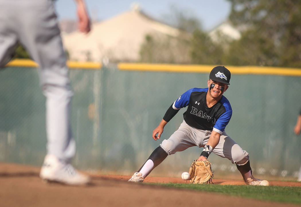Basic's Dominik Tavares (5) catches a ground ball in the fourth inning of a baseball game at Liberty High School in Henderson, Tuesday, March 19, 2019. (Caroline Brehman/Las Vegas Review-Journal) ...