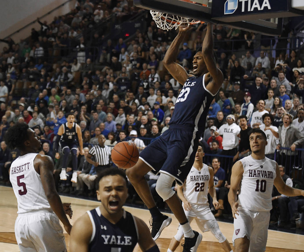 Yale's Jordan Bruner dunks the ball during the second half of an NCAA college basketball game for the Ivy League championship against Harvard at Yale University in New Haven, Conn., Sunday, March ...