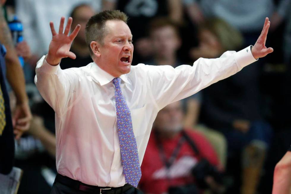 Colorado State head coach Niko Medved directs his team against Colorado in the first half of an NCAA college basketball game Saturday, Dec. 1, 2018, in Boulder, Colo. (AP Photo/David Zalubowski)