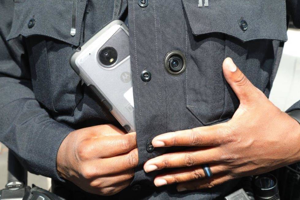 Henderson officer E. Duncan mounts his body-worn camera into place on his uniform. The cameras are part of a newly integrated system required by Senate Bill 176, which went into effect on Sunday, ...