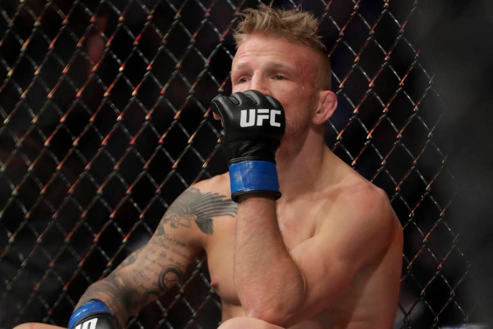 FILE - In this Jan. 20, 2019 file photo, TJ Dillashaw reacts after a flyweight mixed martial arts championship bout against Henry Cejudo at UFC Fight Night in New York. Dillashaw has surrendered ...