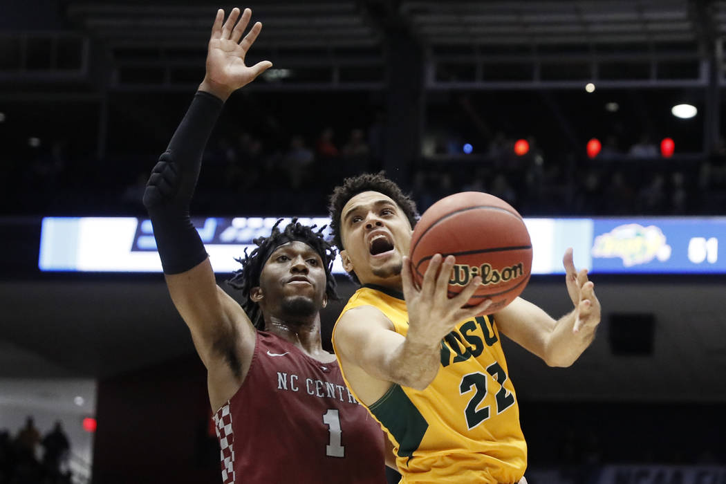 North Dakota State's Cameron Hunter (22) shoots against North Carolina Central's Zacarry Douglas (1) during the second half of a First Four game of the NCAA men's college basketball tournament Wed ...