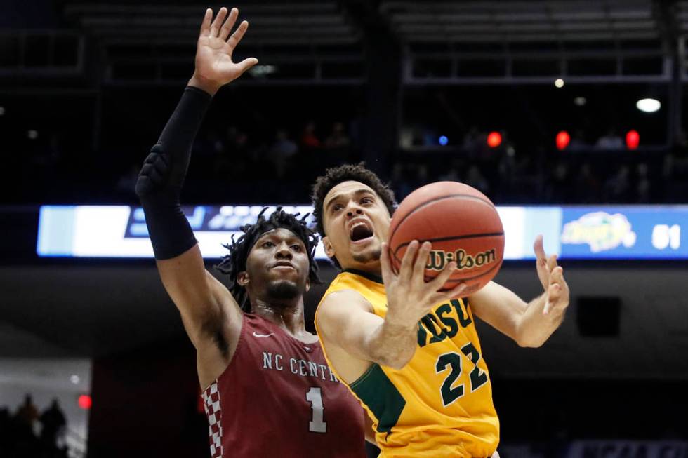 North Dakota State's Cameron Hunter (22) shoots against North Carolina Central's Zacarry Douglas (1) during the second half of a First Four game of the NCAA men's college basketball tournament Wed ...