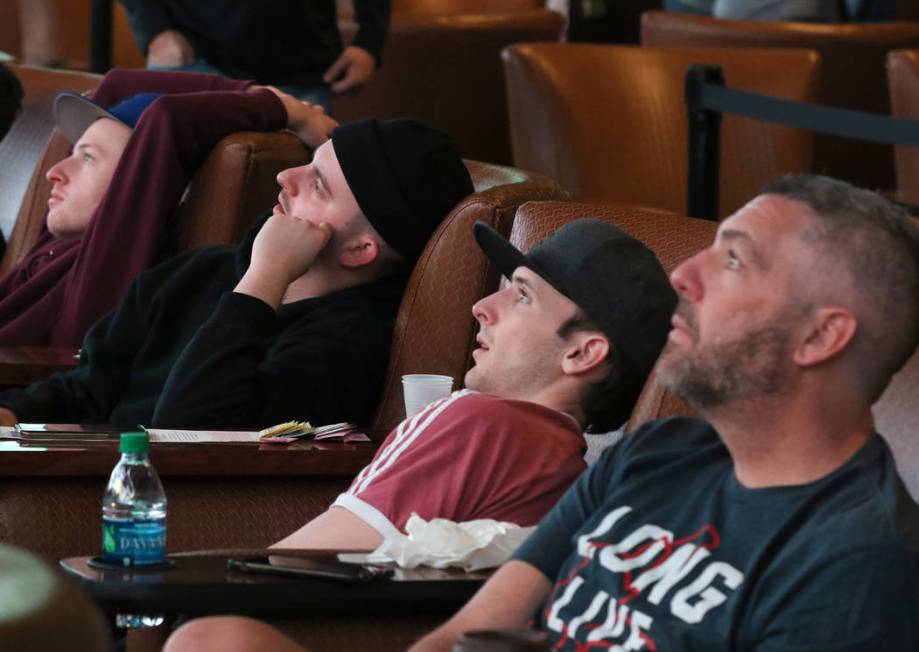 Fans watch a basketball game during the first day of the NCAA basketball tournament at the Westgate sports book in Las Vegas on Thursday, March 16, 2019. (Bizuayehu Tesfaye Las Vegas Review-Journa ...