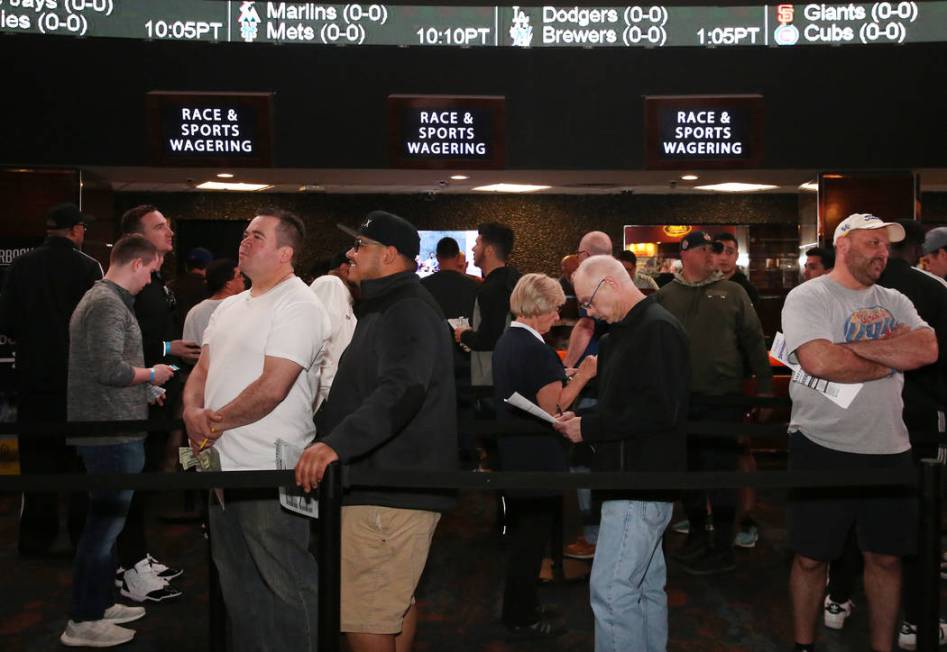 Fans lined up to place their bets during the first day of the NCAA basketball tournament at the Westgate sports book in Las Vegas on Thursday, March 16, 2019. (Bizuayehu Tesfaye Las Vegas Review-J ...