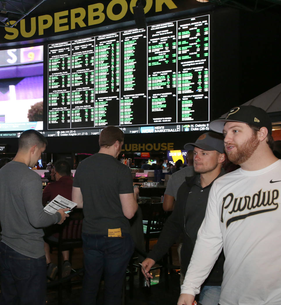 Fans lined up to place their bets during the first day of the NCAA basketball tournament at the Westgate sports book in Las Vegas on Thursday, March 16, 2019. (Bizuayehu Tesfaye Las Vegas Review-J ...