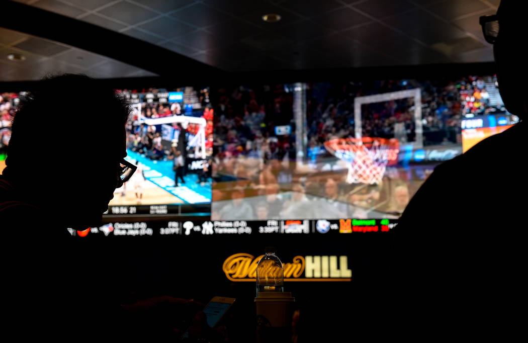 Fans watch the first round of the NCAA men's college basketball tournament at the newly opened sportsbook inside The Strat in Las Vegas, Thursday, March 21, 2019. (Caroline Brehman/Las Vegas Revie ...