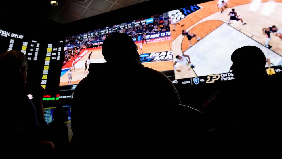 Fans watch the first round of the NCAA men's college basketball tournament at the newly opened sportsbook inside The Strat in Las Vegas, Thursday, March 21, 2019. (Caroline Brehman/Las Vegas Revie ...