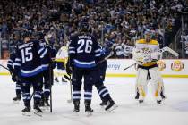 Winnipeg Jets celebrate Andrew Copp's (9) goal as Nashville Predators goaltender Pekka Rinne (35) look on during the second period of an NHL hockey game, Saturday, March 23, 2019 in Winnipeg, Mani ...