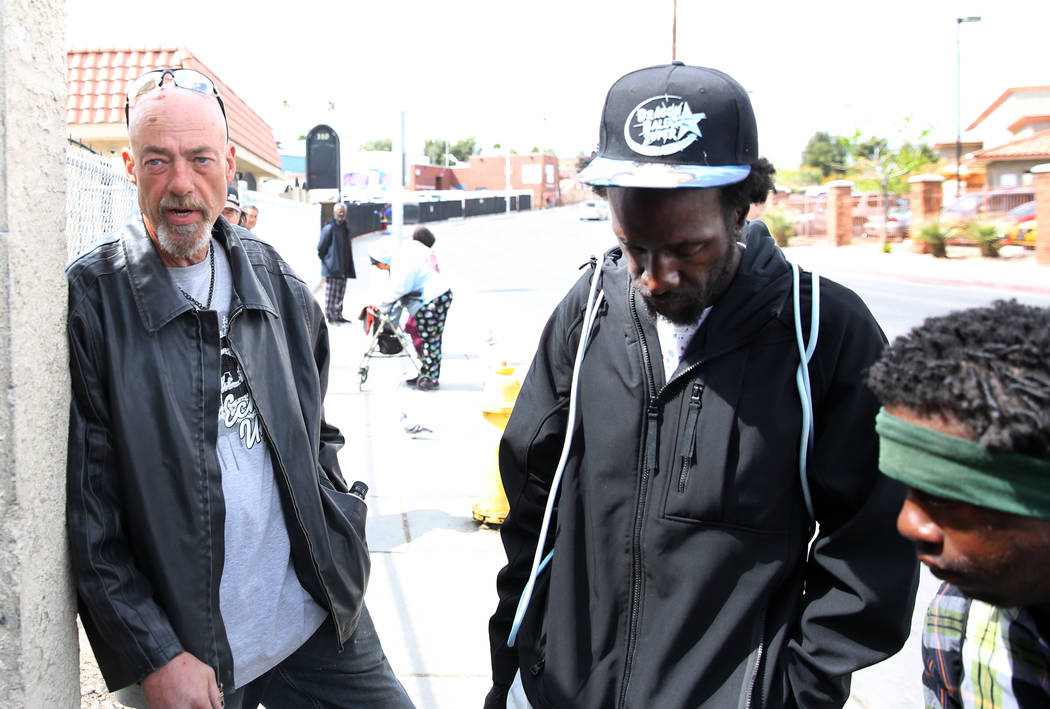 Kelon White, 31, right, and Lavelle Smith, center, listen as Lyle Ringersma speaks during an in ...