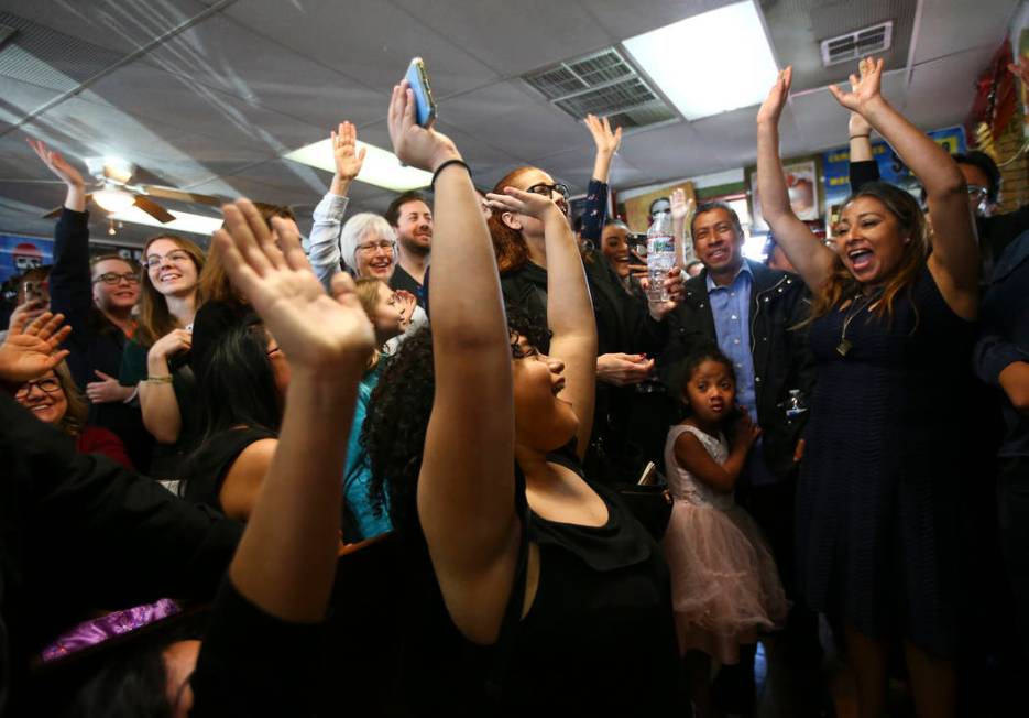 Attendees cheer while listening to Democratic presidential candidate and former Texas congressman Beto O'Rourke, not pictured, during a campaign stop at Arandas Taqueria in Las Vegas on Sunday, Ma ...