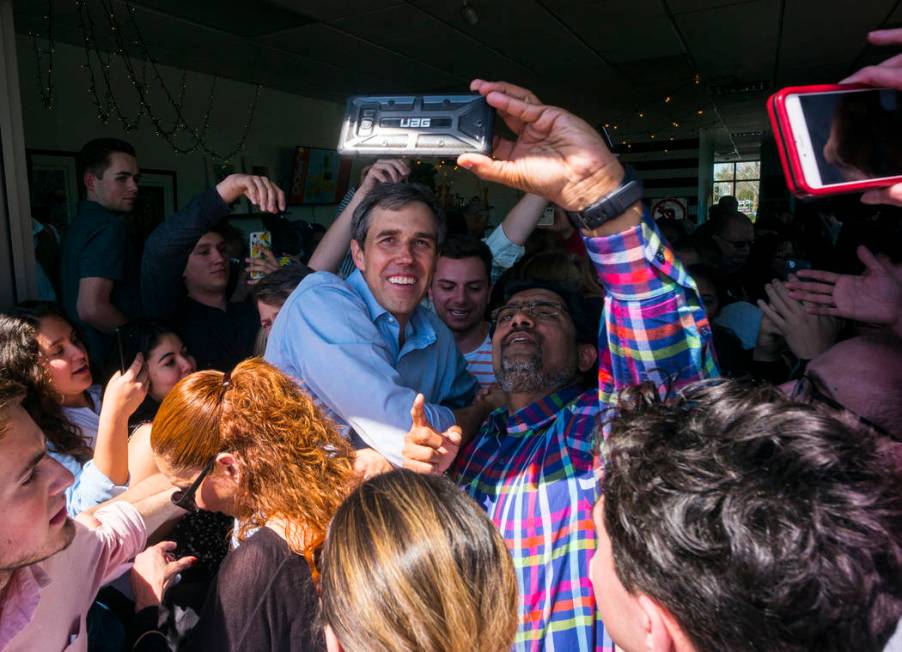 Democratic presidential candidate and former Texas congressman Beto O'Rourke takes pictures with supporters during a campaign stop at Pour Coffeehouse in Las Vegas on Sunday, March 24, 2019. (Chas ...