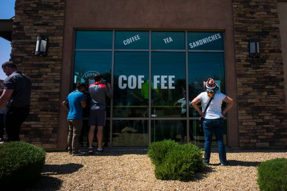 An overflow crowd listens to Democratic presidential candidate and former Texas congressman Beto O'Rourke, not pictured, speak during a campaign stop at Pour Coffeehouse in Las Vegas on Sunday, Ma ...