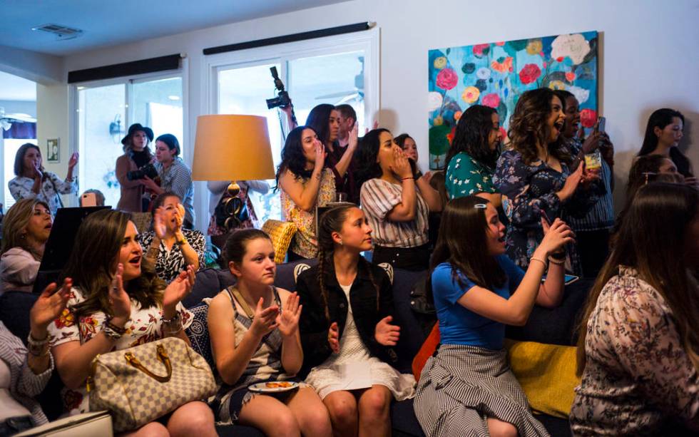 Members of the Mujeres Network cheer as Democratic presidential candidate and former Texas congressman Beto O'Rourke, not pictured, speaks during a meet and greet event with the Mujeres Network in ...