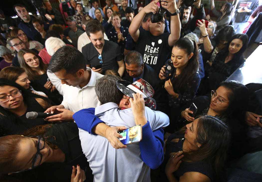 Democratic presidential candidate and former Texas congressman Beto O'Rourke hugs Susy Cazarin, who lost her son to an opioid overdose, during a campaign stop at Arandas Taqueria in Las Vegas on S ...